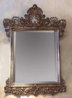A silver framed Juan Carlos Pallarols mirror. 